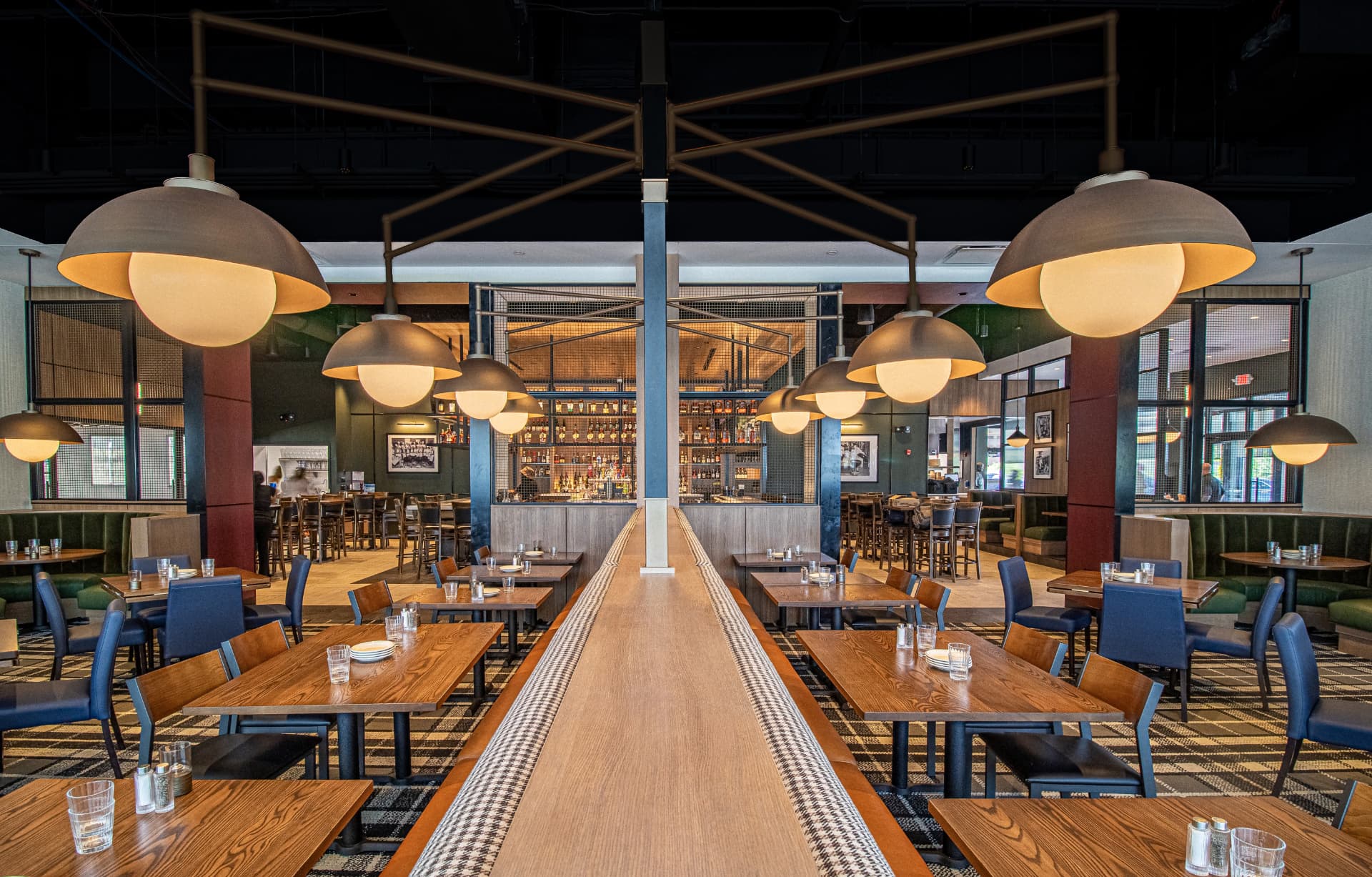 Weber Grill dining room with sculptural pendant lighting and a long communal table